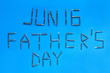 Happy fathers 'Day inscription with screwdrivers on a blue background, top view, flat layout, fathers' Day.
