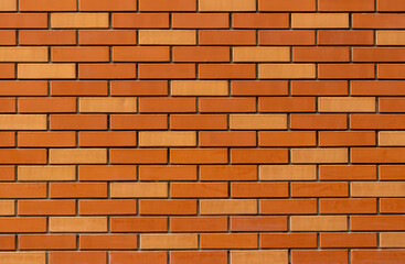 texture of colored red brick wall close up , ginger bricks background macro , orange bricklaying surface backdrop