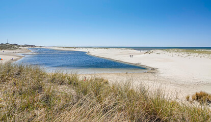 Fototapeta na wymiar The Blue lagoon at Camperduin, Noord Holland, The Netherlands. A very popular tourist destination on this recently created beach on the north west coast of Holland.