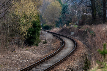 train tracks turning in the forest