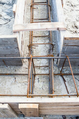 Fragment wooden formwork with metal armature for the construction of the cottage.