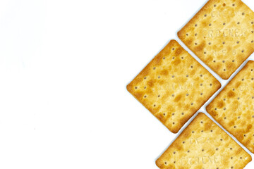 Cream cracker biscuit isolated on white background with copy space.