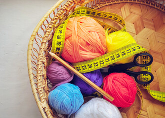 Creative mess. Tools needed for handmade in a wicker basket.