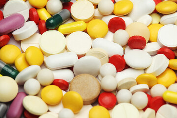 Different colorful tablets at white background