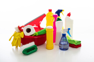 Cleaning supplies and bowls isolated against white background.