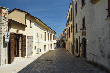 Fototapeta na wymiar Montefusco, Italy, 05/01/2017. A street between the old houses of a medieval town