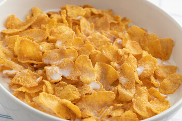 Bowl with traditional cornflakes close up