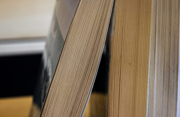 close up of a stack of books on a table