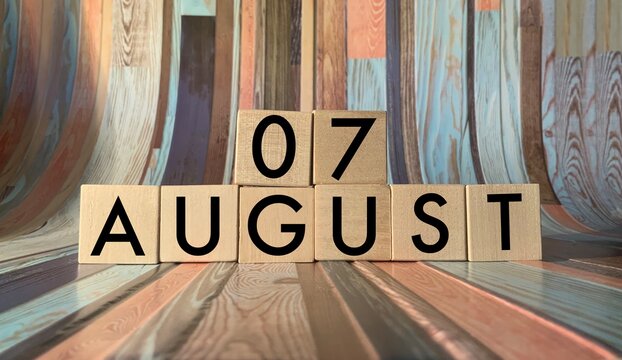 August 7. August 7 on wooden cubes on a wooden background. An image for a holiday .Summer day. Calendar 