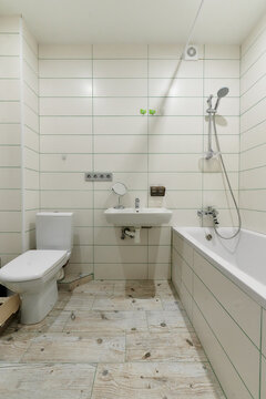 bathroom, toilet, sink, bathtub, white, light with white tiles