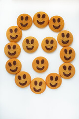 A set of smiling biscuit cookies isolated on white background with copy space. Smile concept. Sweet greeting