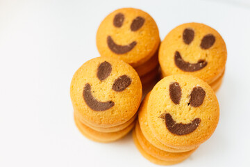 A set of smiling biscuit cookies isolated on white background with copy space. Smile concept. Sweet greeting