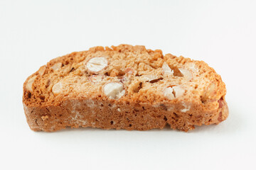 Popular Italian Biscotti or Cantucci biscuit cookie stuffed with nuts isolated on white background with copy space.Side view closeup