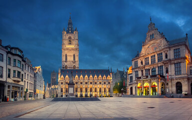 Naklejka na ściany i meble Ghent, Belgium. Sint-Baafsplein square at dusk with building of historic Town Hall and famous Belfry of Ghent