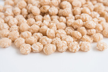 Balls for Breakfast, a side view. background texture. Beige shades.