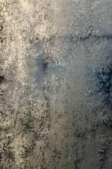 frost patten on the winter window in sunny day