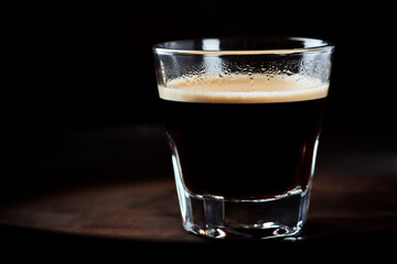Cup of espresso on dark background. Close up. 