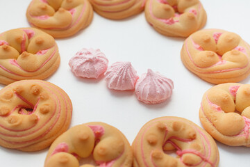 Cookie biscuit with pink  sugar cream icing  isolated on white background