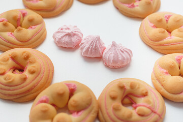 Cookie biscuit with pink  sugar cream icing  isolated on white background