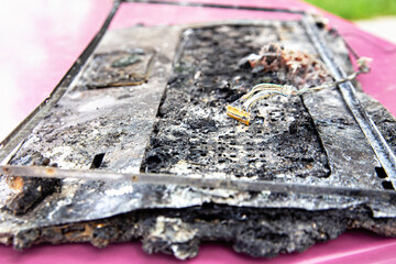 Computer Fire. Broken laptop computer spoiled by flame