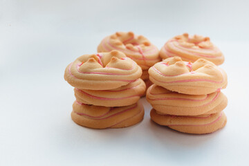 Cookie biscuit with pink  sugar cream icing  isolated on white background