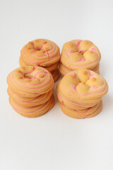 Cookie biscuit with pink  sugar cream icing  isolated on white background