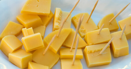 slices of yellow cheese on a plate