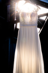 Bridal dress in a working shed with beautiful sunlight