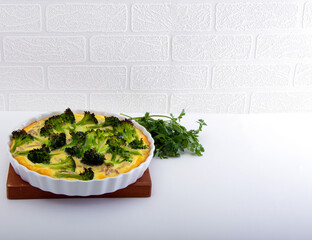 Baked Quiche with Broccoli, Onion, Meat and Bacon.