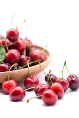 Obraz na płótnie Canvas ripe red may cherries on a plate on white background