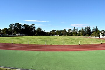 Sports field in Tokyo with blue sky.