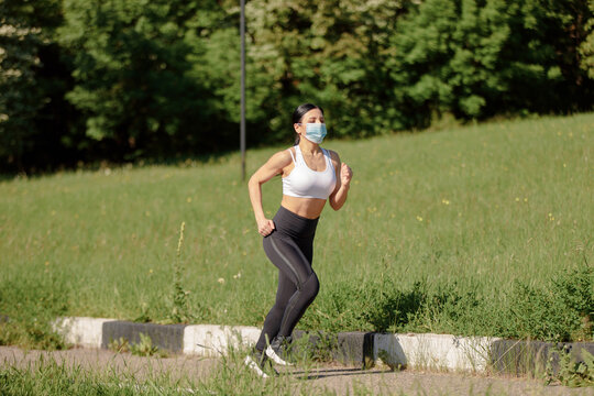 A beautiful young woman is engaged in sports in nature. 