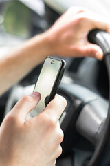 Man using mobile phone in car