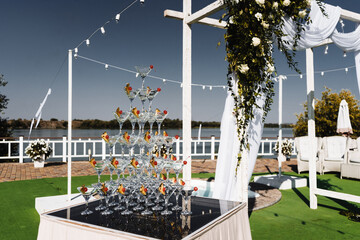 Wedding arch and a pyramid of glasses