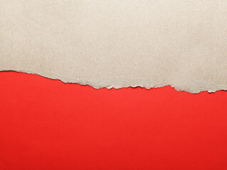 Gray paper cardboard with torn edges isolated with a bright red color paper background inside. Good paper texture