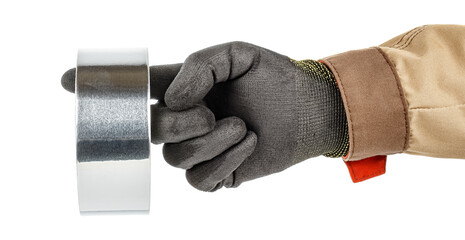 Roll of aluminium foil adhesive tape hanging on finger of worker hand in black protective glove and brown uniform isolated on white background