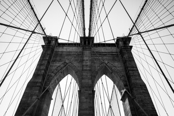 Brooklyn Bridge in black and white with lots of symmetry shot in September 2019, New York USA