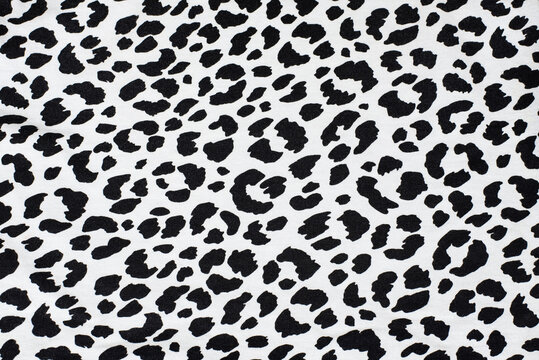 Black spots of different shapes on white background - imitation of dolmatine dog skin