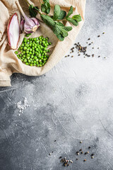 english style mushy peas organic  ingredients peas mint shallot pepper and salt  keto food  photo over grey stone background and cloth top view vertical. Concept space for text