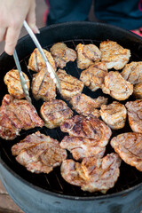 Pork meat on grill, family party, closeup