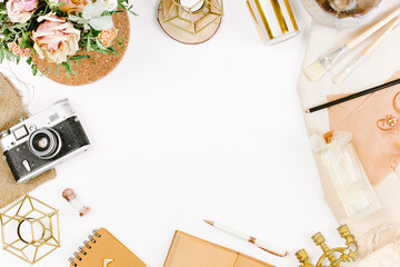 Creative template in vintage style for wedding or birthday invitation card with film camera, envelope, candlestick, vase, flowers and brushes. An elegant workspace of creative man. Flat lay, top view
