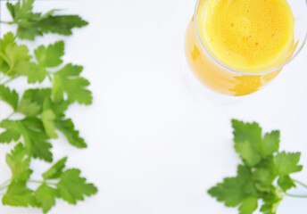 Green parsley and  orange in slices on a white