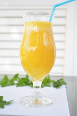 Green parsley and  orange in slices on a white