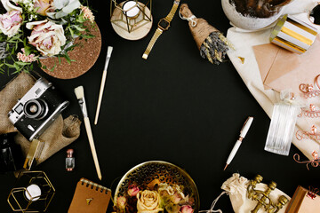 Creative template in vintage style for wedding or birthday invitation card with envelope, candlestick, vase, flowers and brushes. An elegant workspace of creative man. Flat lay, top view