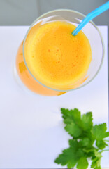 Green parsley and  orange in slices on a white