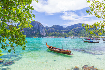 Naklejka na ściany i meble Boats, the Andaman Sea and hills in Ko Phi Phi Don, Thailand