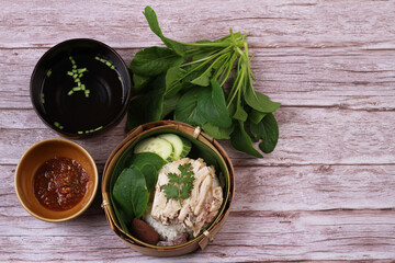 Hainanese chicken rice, Thailand cuisine  on wood background