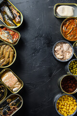 Canned conserve products in tin cans. with fresh organic ingridients Saury, mackerel, sprats, sardines, pilchard, squid, tuna pinapple, corn, peas, mango ,  beans,   over  black stone