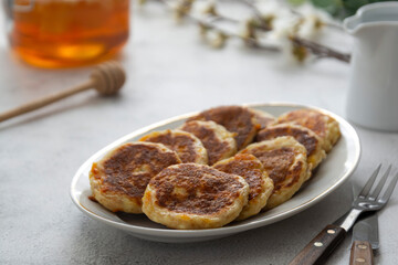 Cheese pancakes, breakfast food. Rounf frities made from cotage cheese.
