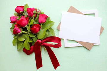 postcard mockup. a small bouquet of red roses and space for text. congratulation. invitation